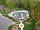 An aerial view of a neighborhood clubhouse and pool surrounded by lush trees at 9069 Blue Ridge Dr, Indian Land, SC 29707