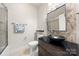 Stylish bathroom features a unique sink, vanity, and a beautifully tiled shower at 9069 Blue Ridge Dr, Indian Land, SC 29707