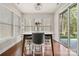 Charming dining space filled with natural light, complemented by modern furnishings and hardwood floors at 9069 Blue Ridge Dr, Indian Land, SC 29707
