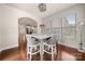 Bright dining room with hardwood floors and access to other rooms, perfect for entertaining guests at 9069 Blue Ridge Dr, Indian Land, SC 29707