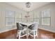 Sunlit dining area featuring hardwood floors and plenty of natural light for a warm and inviting atmosphere at 9069 Blue Ridge Dr, Indian Land, SC 29707
