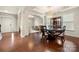 Elegant dining room with a chandelier, hardwood floors, and stylish furnishings at 9069 Blue Ridge Dr, Indian Land, SC 29707