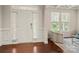 Bright entryway featuring hardwood floors, a stylish front door, and ample natural light at 9069 Blue Ridge Dr, Indian Land, SC 29707