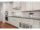 Modern kitchen with stainless steel appliances, white cabinetry, and ample counter space at 9069 Blue Ridge Dr, Indian Land, SC 29707
