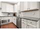 Bright kitchen with white cabinets, stainless steel appliances, and granite countertops at 9069 Blue Ridge Dr, Indian Land, SC 29707