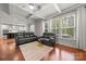 Bright living room boasts hardwood floors, coffered ceilings, and an open layout to the kitchen at 9069 Blue Ridge Dr, Indian Land, SC 29707