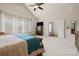 View of main bedroom with tray ceiling, sitting area, and ensuite bath at 9069 Blue Ridge Dr, Indian Land, SC 29707