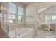Bathroom features a soaking tub and tile surround, and adjoins main bedroom at 9069 Blue Ridge Dr, Indian Land, SC 29707