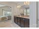 Bathroom features a dual vanity, granite counters, and opens to main bedroom at 9069 Blue Ridge Dr, Indian Land, SC 29707