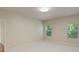 Neutral bedroom features two windows offering natural light and hardwood flooring at 9069 Blue Ridge Dr, Indian Land, SC 29707