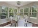 Cozy breakfast nook features a ceiling fan and plenty of natural light from surrounding windows at 9069 Blue Ridge Dr, Indian Land, SC 29707