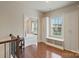 Upstairs hallway has built-in storage and a window seat with a view to the outdoors at 9069 Blue Ridge Dr, Indian Land, SC 29707