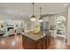 Open concept kitchen with island flows into the living and dining areas for easy entertaining at 9069 Blue Ridge Dr, Indian Land, SC 29707