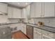 Well-lit kitchen showcasing stainless steel appliances, modern cabinets, and granite countertops at 9069 Blue Ridge Dr, Indian Land, SC 29707