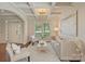 Bright living room features coffered ceilings, stylish decor, and plenty of natural light for a welcoming space at 9069 Blue Ridge Dr, Indian Land, SC 29707