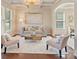 Inviting living room features stylish furniture, coffered ceilings, and elegant decor for comfortable living at 9069 Blue Ridge Dr, Indian Land, SC 29707