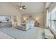 Bright main bedroom features a vaulted ceiling, sitting area, and ensuite bathroom at 9069 Blue Ridge Dr, Indian Land, SC 29707
