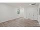 Bright bedroom featuring a window, bathroom access, and modern floors at 908 Woodside Dr, Kings Mountain, NC 28086