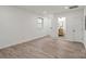 Bright bedroom features modern wood floors and a view of the bathroom at 908 Woodside Dr, Kings Mountain, NC 28086