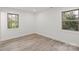 Bright bedroom with two windows offering natural light and views of outside at 908 Woodside Dr, Kings Mountain, NC 28086