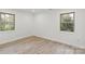 Bright bedroom featuring two windows with a view of greenery outside at 908 Woodside Dr, Kings Mountain, NC 28086