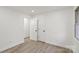Bedroom featuring modern floors, a view of the bathroom, and a window at 908 Woodside Dr, Kings Mountain, NC 28086