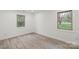 Bright bedroom boasting two windows and modern wood floors at 908 Woodside Dr, Kings Mountain, NC 28086