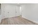 A spacious bedroom featuring modern flooring, two doors, and one window at 908 Woodside Dr, Kings Mountain, NC 28086