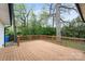 Spacious wood deck perfect for outdoor entertaining overlooking the backyard with a tree at 908 Woodside Dr, Kings Mountain, NC 28086