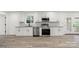 Bright kitchen features stainless steel appliances and marble countertops at 908 Woodside Dr, Kings Mountain, NC 28086