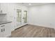 Bright living room with hardwood floors opens to a screened porch at 908 Woodside Dr, Kings Mountain, NC 28086