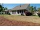 View of the back of the home from the backyard with a fenced in yard at 9319 Kestral Ridge Dr, Charlotte, NC 28269