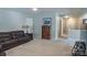 View of the upstairs bonus room, carpeted, with nice furnishings and view to the staircase at 9319 Kestral Ridge Dr, Charlotte, NC 28269