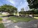Enjoy the outdoors in the community common area with lush landscaping and seating at 9319 Kestral Ridge Dr, Charlotte, NC 28269