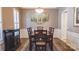Dining room with traditional decor, wood floors, area rug and unique light fixture at 9319 Kestral Ridge Dr, Charlotte, NC 28269