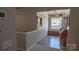 Entry view with hardwood floors, window seat, and built in storage at 9319 Kestral Ridge Dr, Charlotte, NC 28269