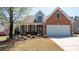 Attractive brick home with a well-maintained yard, attached garage, and inviting curb appeal at 9319 Kestral Ridge Dr, Charlotte, NC 28269