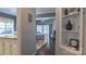 Hallway with tile and hardwood floors leads into rooms with neutral paint scheme and shelving at 9319 Kestral Ridge Dr, Charlotte, NC 28269