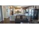 Open concept living room featuring the kitchen with a breakfast bar for added seating at 9319 Kestral Ridge Dr, Charlotte, NC 28269