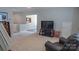 Living room featuring large television and view of the entry area at 9319 Kestral Ridge Dr, Charlotte, NC 28269