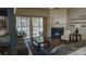 Bright living room boasts hardwood floors, a fireplace, and a sliding door to screened porch at 9319 Kestral Ridge Dr, Charlotte, NC 28269
