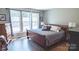 Comfortable main bedroom with natural light, hardwood floors, and neutral colors at 9319 Kestral Ridge Dr, Charlotte, NC 28269