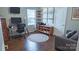 Well-lit office space with hardwood floors, desk, and shelves at 9319 Kestral Ridge Dr, Charlotte, NC 28269