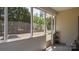 Spacious screened porch offers views of the big backyard with mature trees and garden at 9319 Kestral Ridge Dr, Charlotte, NC 28269