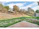 A well-maintained backyard with trees, fence, and a storage shed, ready for outdoor activities at 98 Poplar Woods Dr, Concord, NC 28027