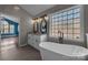 A luxurious bathroom boasting double vanity, modern fixtures, and a standalone soaking tub at 98 Poplar Woods Dr, Concord, NC 28027