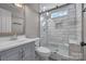 Modern bathroom featuring a sleek shower with glass doors and white marbled tile at 98 Poplar Woods Dr, Concord, NC 28027