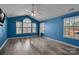 Large bright bedroom with vaulted ceiling, large windows, and wood flooring at 98 Poplar Woods Dr, Concord, NC 28027