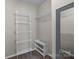 Functional walk-in closet featuring wire shelving, a shoe rack, and a mirror at 98 Poplar Woods Dr, Concord, NC 28027