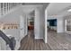 Spacious entryway with hardwood floors and access to kitchen, dining and stairway at 98 Poplar Woods Dr, Concord, NC 28027